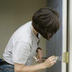 Woman Painting a Door